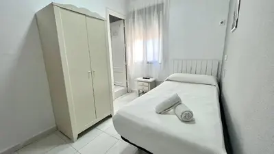 Cama o camas de una habitación en Hostal Carlos III