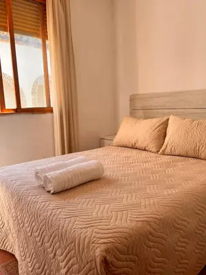 Cama o camas de una habitación en APARTAMENTO LA MURALLA 2