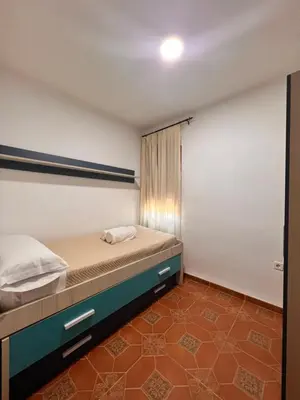 Cama o camas de una habitación en APARTAMENTO LA MURALLA 2