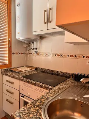 Una cocina o zona de cocina en APARTAMENTO LA MURALLA 2