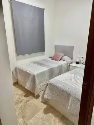 Cama o camas de una habitación en Apartamento acogedor y moderno en pleno centro de Sevilla con Parking Gratis