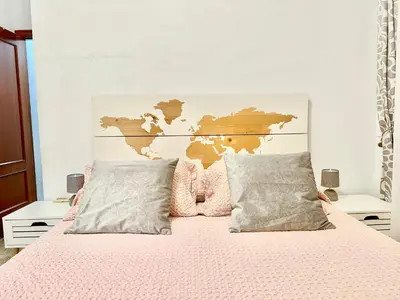 Cama o camas de una habitación en Apartamento acogedor y moderno en pleno centro de Sevilla con Parking Gratis