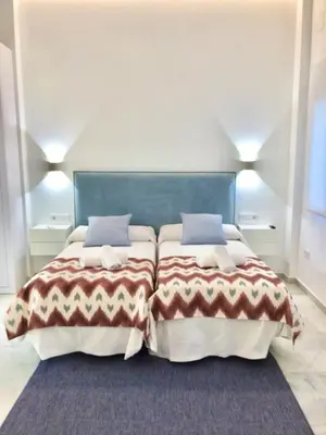 Cama o camas de una habitación en Apart Los Patios de Valladares