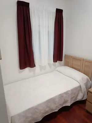 Cama o camas de una habitación en Lyrioshomes Apartamento Filpo Rojas , Sevilla