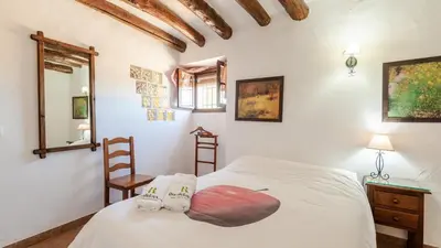 Cama o camas de una habitación en El Cortijuelo de la Media Luna Alcalá La Real by Ruralidays