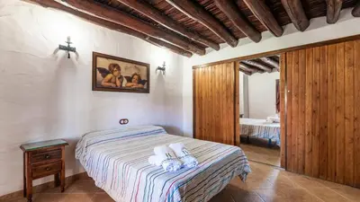 Cama o camas de una habitación en El Cortijuelo de la Media Luna Alcalá La Real by Ruralidays