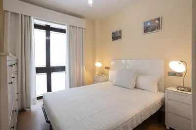 Cama o camas de una habitación en Sol Sevilla Urban Apartment