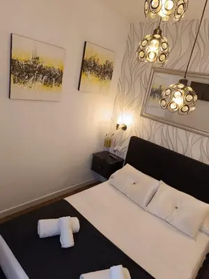 Cama o camas de una habitación en Hostal Casa Blanca