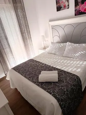 Cama o camas de una habitación en Hostal Casa Blanca