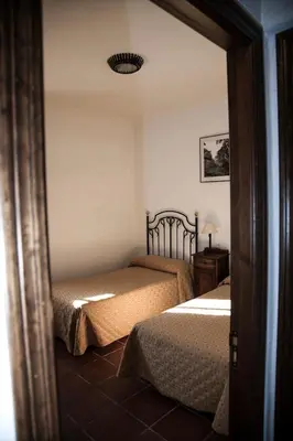 Cama o camas de una habitación en Cortijo Charcollana