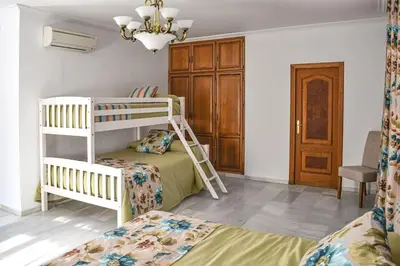 Cama o camas de una habitación en Villa Tela & Vino