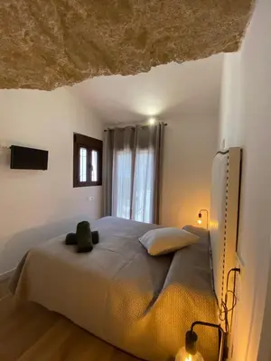 Cama o camas de una habitación en Casa Cueva “El Refugio en la Cueva”