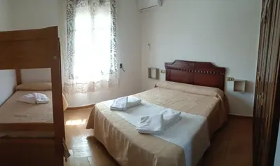 Cama o camas de una habitación en La Masía casa rural junto al río