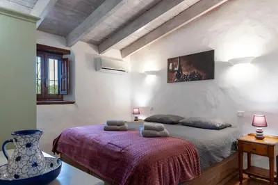 Cama o camas de una habitación en Casa Uva española, SL