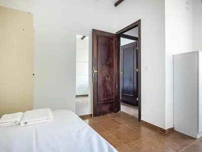 Cama o camas de una habitación en Villa Santa Teresa Vacacional Sevilla