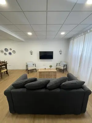 Una televisión o centro de entretenimiento en Casa Luna de Antequera