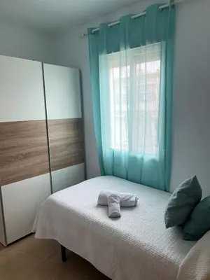 Cama o camas de una habitación en Ático Gran Terraza Villa Luz
