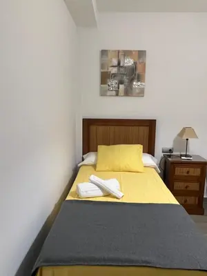 Cama o camas de una habitación en Azahar Macarena
