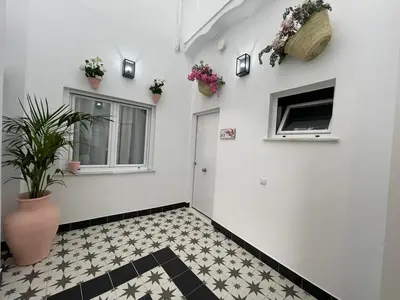 Una televisión o centro de entretenimiento en Apartamentos Casa el Gorras