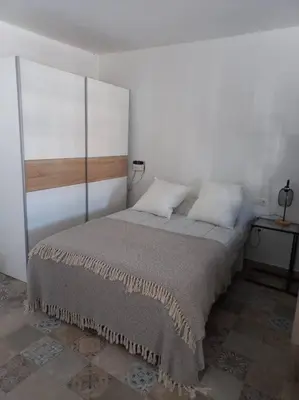 Cama o camas de una habitación en LOFT EN PATIO DE CASA TÍPICA DE PUEBLO