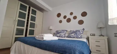 Cama o camas de una habitación en Piso familiar y con encanto