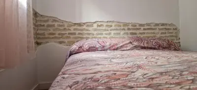 Cama o camas de una habitación en Piso familiar y con encanto