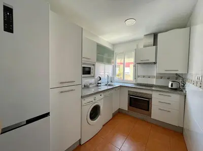 Una cocina o zona de cocina en Geysotur El Ático Blanco