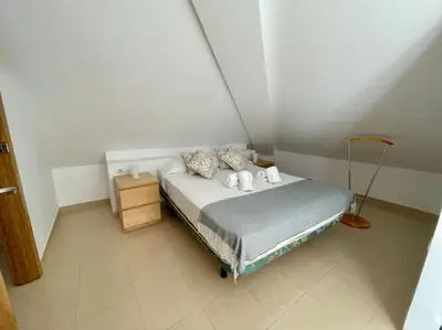 Cama o camas de una habitación en Geysotur El Ático Blanco