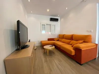 Una televisión o centro de entretenimiento en Central and cozy apartment in Seville