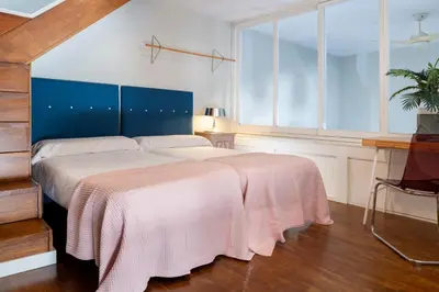 Cama o camas de una habitación en Misterhost Conde de Torrejón