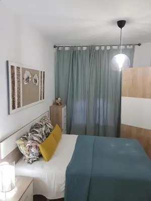 Cama o camas de una habitación en APARTAMENTo ENCANTADOR