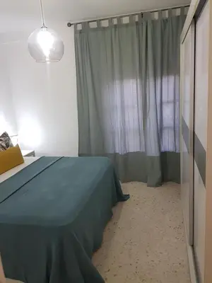 Cama o camas de una habitación en APARTAMENTo ENCANTADOR