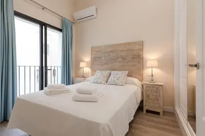 Cama o camas de una habitación en San Luis Downtown & Pool Apartment