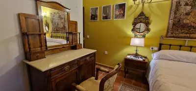 Cama o camas de una habitación en Cortijo Rodeo. Alojamiento Rural