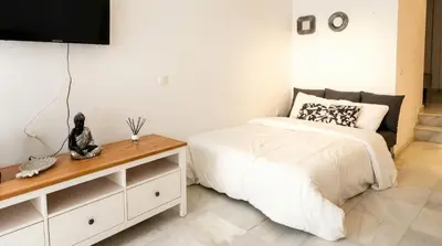 Cama o camas de una habitación en Lovely apt in the city center - 15m walk Giralda
