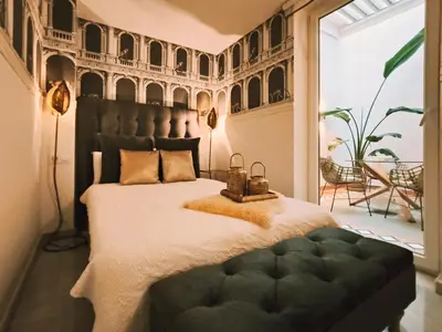 Cama o camas de una habitación en Designer Apartment
