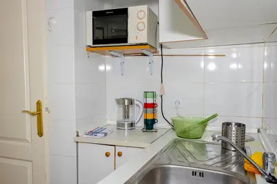 Una cocina o zona de cocina en WISH SUITE ALAMEDA DE SEVILLA
