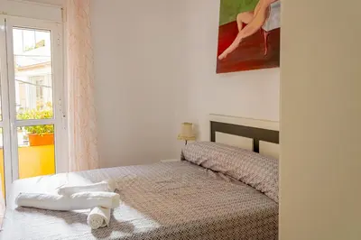Cama o camas de una habitación en WISH SUITE ALAMEDA DE SEVILLA