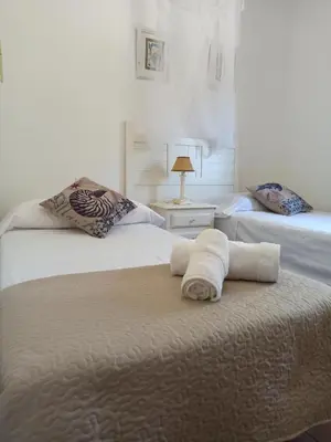 Cama o camas de una habitación en Villa Cuatro Encinas, Iznájar