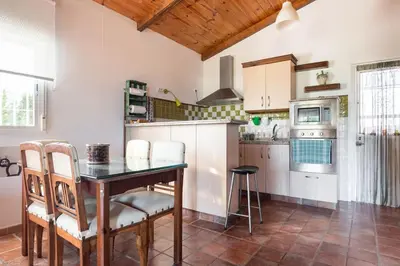 Una cocina o zona de cocina en Casa de Madera del Turullote
