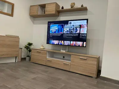 Una televisión o centro de entretenimiento en Apartamento Puerta San Jose