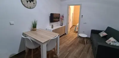 Una televisión o centro de entretenimiento en Apartamento Puente Triana