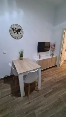Una televisión o centro de entretenimiento en Apartamento Puente Triana