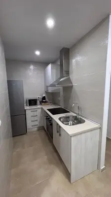 Una cocina o zona de cocina en Apartamentos la Catedral de Jaén