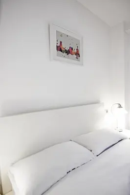 Cama o camas de una habitación en RentalSevilla Doctor Barraquer