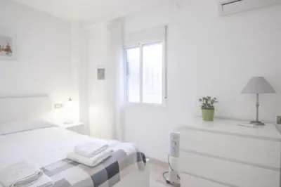 Cama o camas de una habitación en RentalSevilla Doctor Barraquer