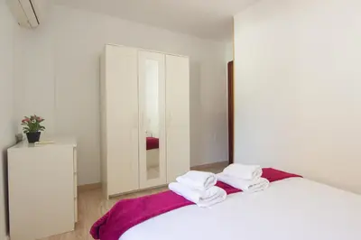 Cama o camas de una habitación en RentalSevilla Doctor Barraquer