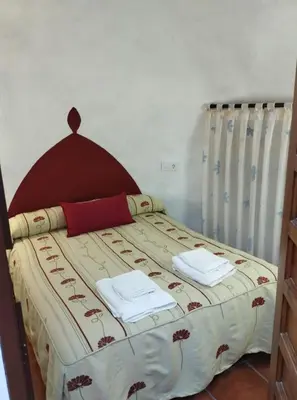 Cama o camas de una habitación en Alojamiento rural casa cueva abuelo Miguel