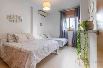 Cama o camas de una habitación en Apartamento 4 en Estadio Sevilla 8 plazas y metro