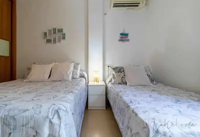 Cama o camas de una habitación en Apartamento 4 en Estadio Sevilla 8 plazas y metro